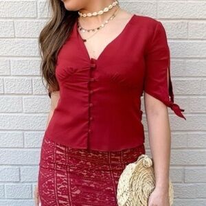Burgundy feminine button down v-neck blouse with tie-up sleeve details size LG